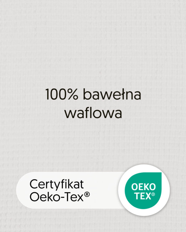 Zbliżenie bawełny waflowej w kolorze naturalnym z tekstem „100% bawełna waflowa” i oznaczeniem OEKO-TEX.