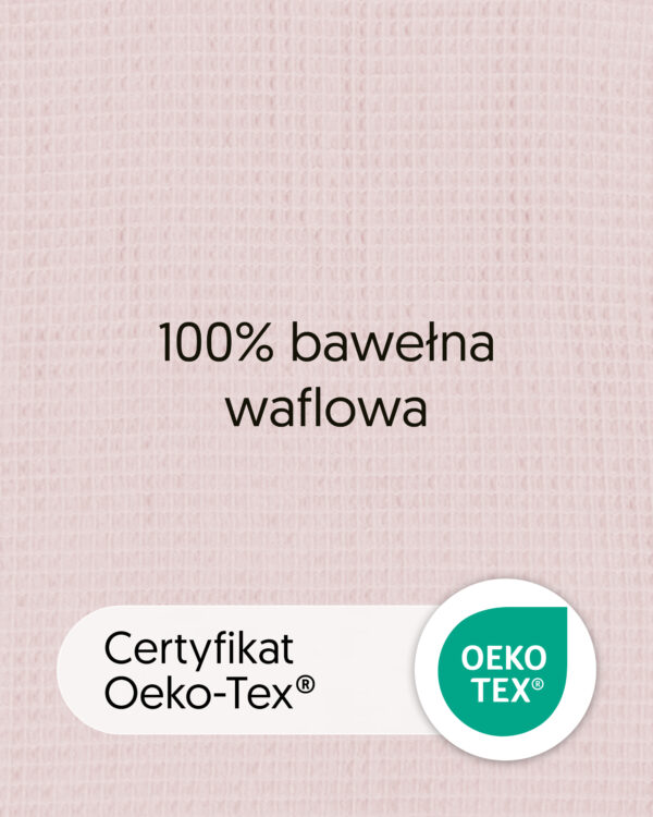 Zbliżenie bawełny waflowej w kolorze różowym z tekstem „100% bawełna waflowa” i oznaczeniem OEKO-TEX.